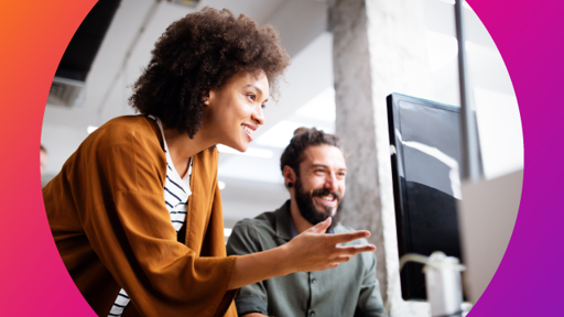 Individuals staring at a desktop in a consulting environment