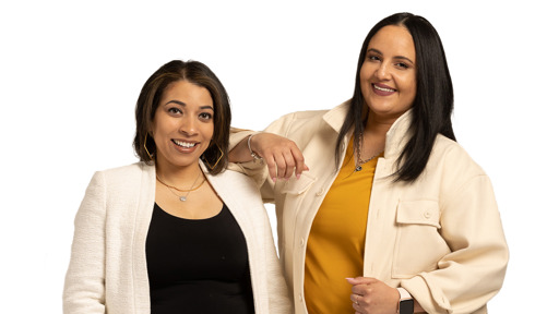 Two individuals smiling next to each other