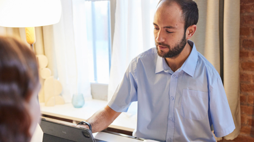 Photo of a person at a reception desk