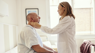 Doctor examining patient in hospital