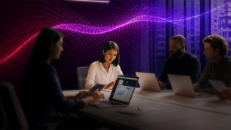 Individuals with laptops and a vibrant glow behind them