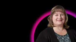 Elaine Orler in front of black background with pink and purple half circle outline graphic