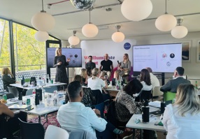 Colleagues in a room viewing a panel